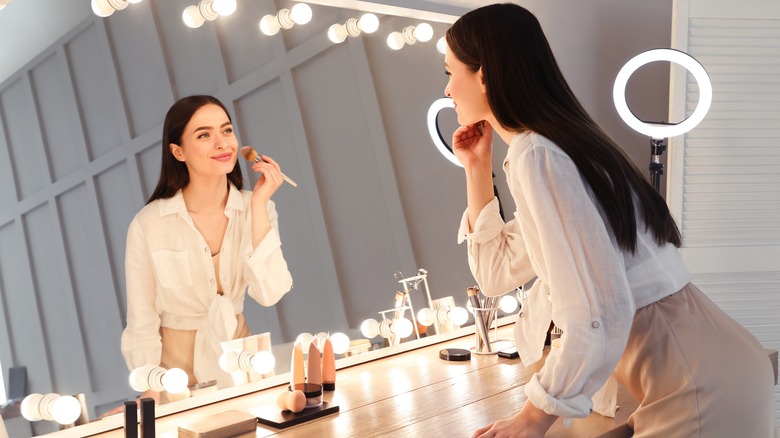 Woman applying powder