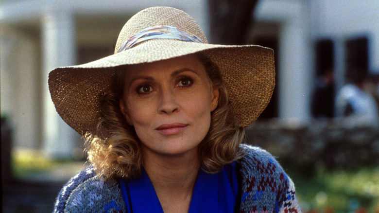 Faye Dunaway on the set for Handmaids tale wearing large wicker hat
