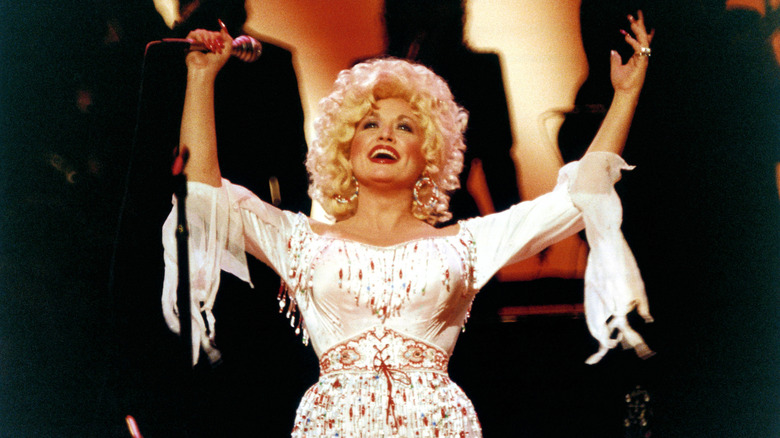 Dolly Parton performing at the Dominion Theatre