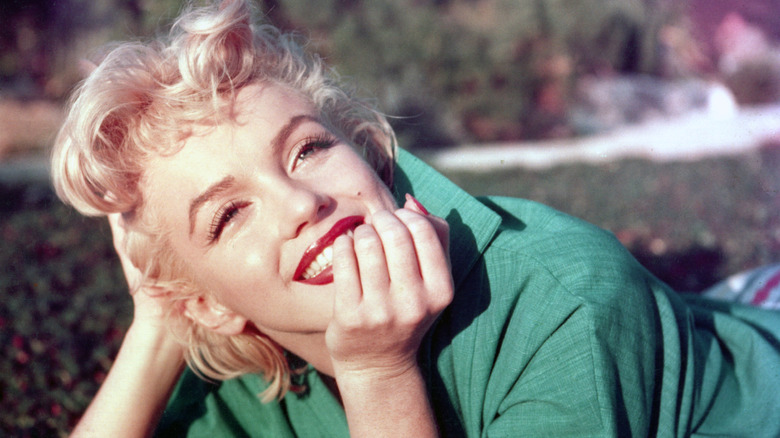 Marilyn Monroe smiling at a promotional photoshoot in 1953