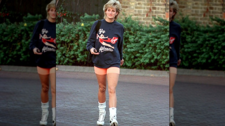 Princess Diana pictured smiling and sitting against a sundial in 1986