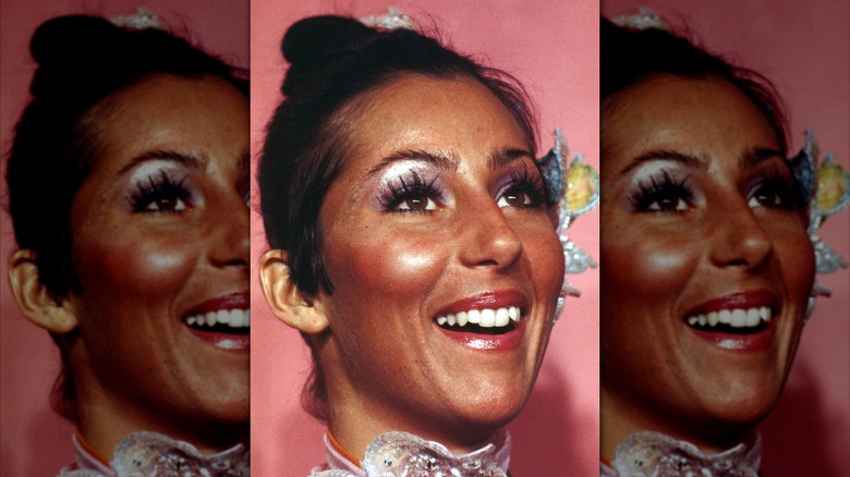 Cher on the red carpet in the 1970s with spiky lashes and pastel metallic eyeshadow