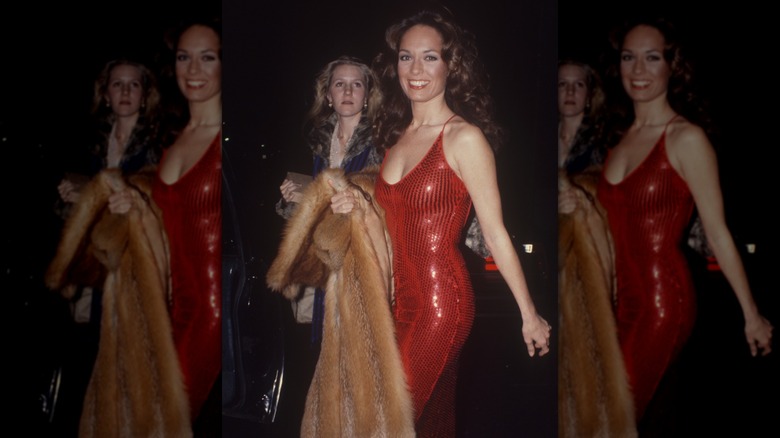 A woman in a red, sequin dress