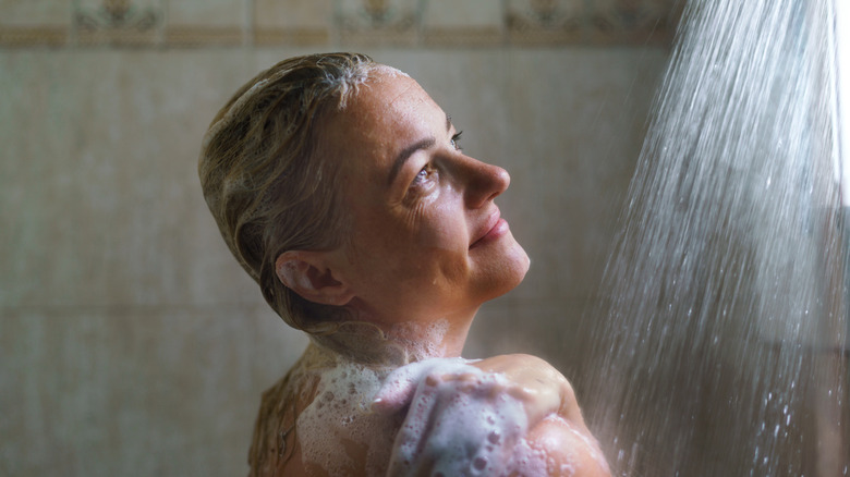Older woman taking a shower