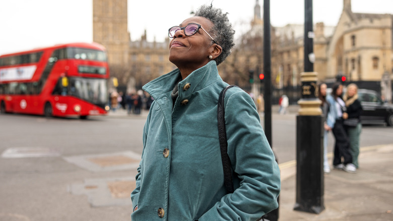 An older woman with short gray looking to the sky in London