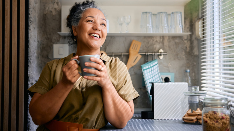 An older woman with gray hair in a kitchen