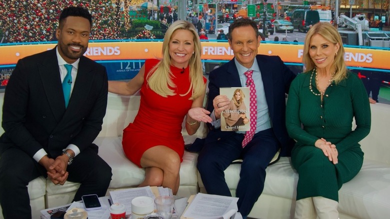 Ainsley Earhardt poses for a photo with co-hosts and guest Cheryl Hines as she appears on Fox & Friends to promot her new book
