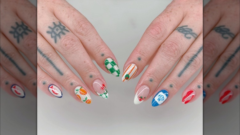 A manicure of small, artistic food drawings