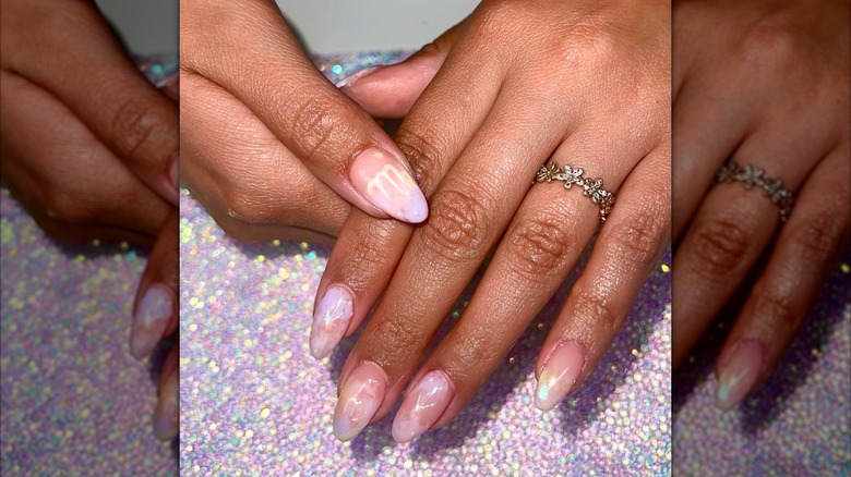 A pastel manicure with the Virgo symbol on Instagram