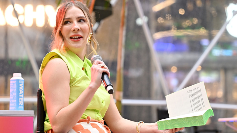 Emily Henry reads to guests during the People We Meet on Vacation summer oasis at Manhattan West Plaza on January 10, 2026