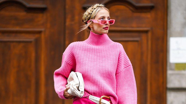 Woman in pink jumper pink sunglasses