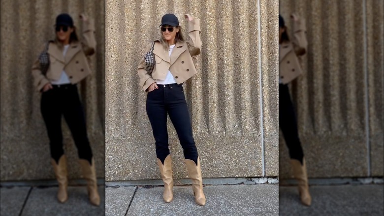 A woman in camel color boots with dark denim
