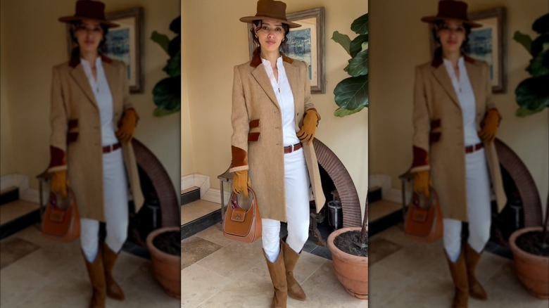 A woman in shades of cream and beige while wearing camel boots