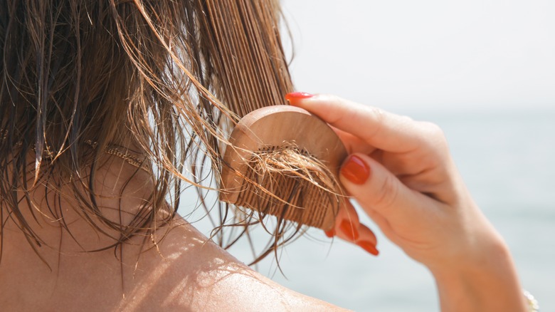 Woman combing her hair