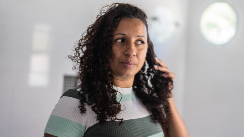 Woman touching hair