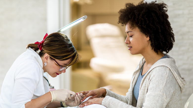 Woman with her nail tech