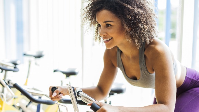 Woman riding a stationary bike