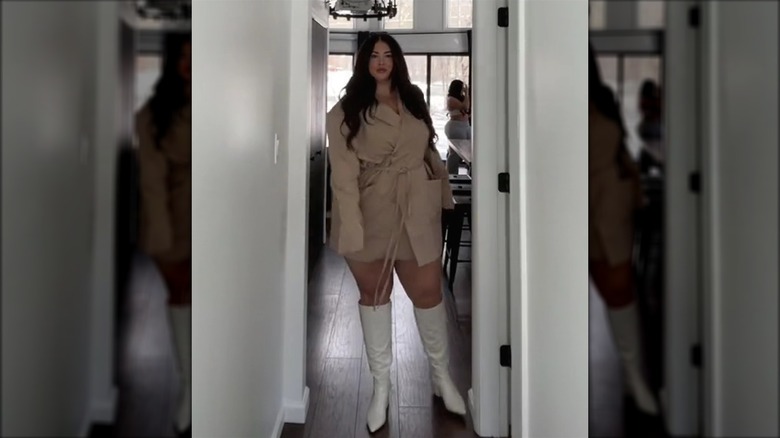 Woman in blazer dress and boots