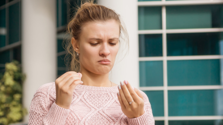 Woman looking at her hands