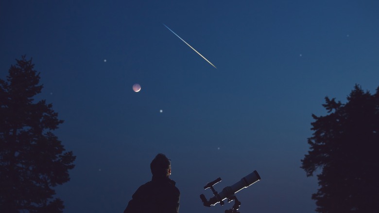 Sky with moon and shooting star