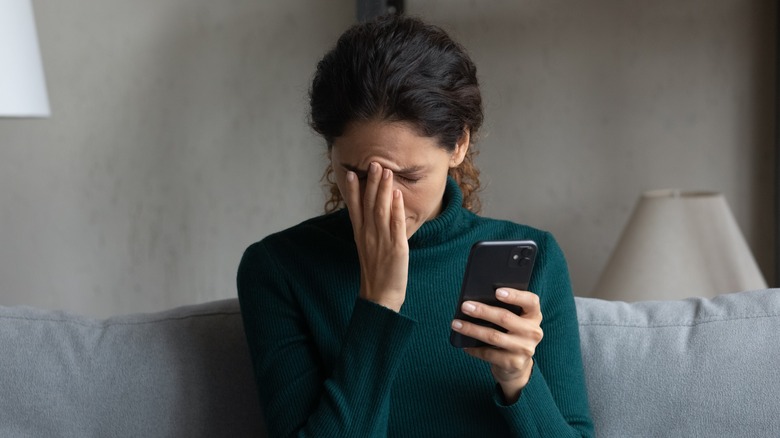 Woman reacting to phone