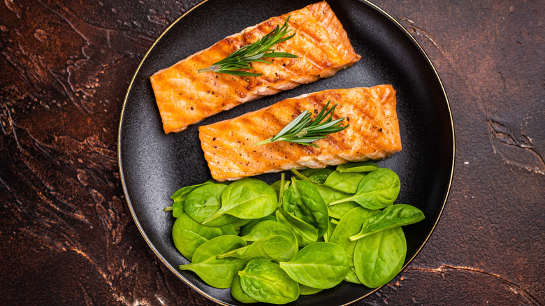 Salmon and spinach in a pan