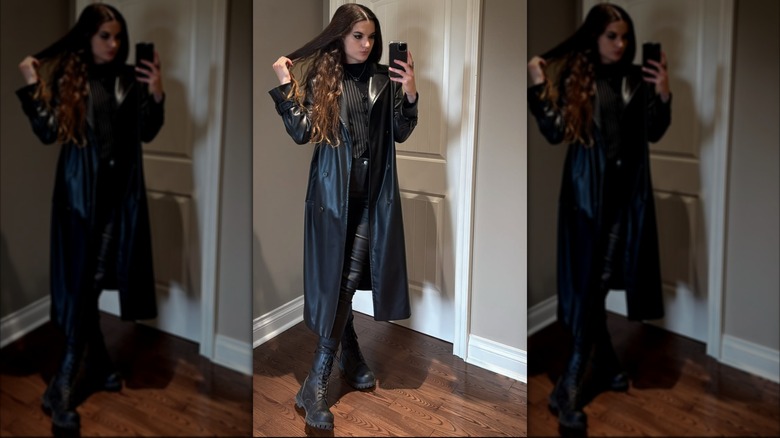 A woman on Instagram taking a selfie wearing all black and black combat boots