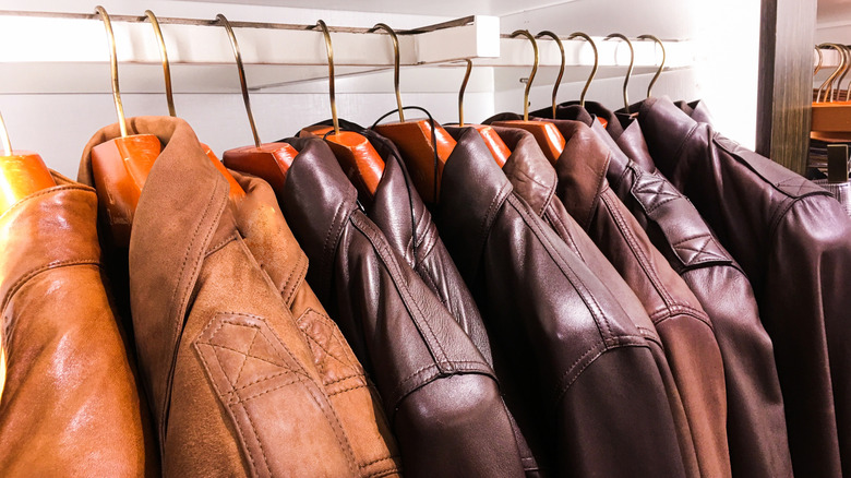A rack of leather coats in different shades of brown