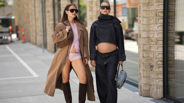 Two models wearing trendy outfits