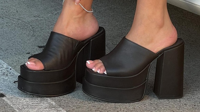 A person wearing chunky heels