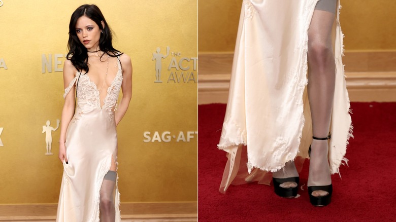 Jenna Ortega wearing peep-toe black heels with a beige satin slip dress