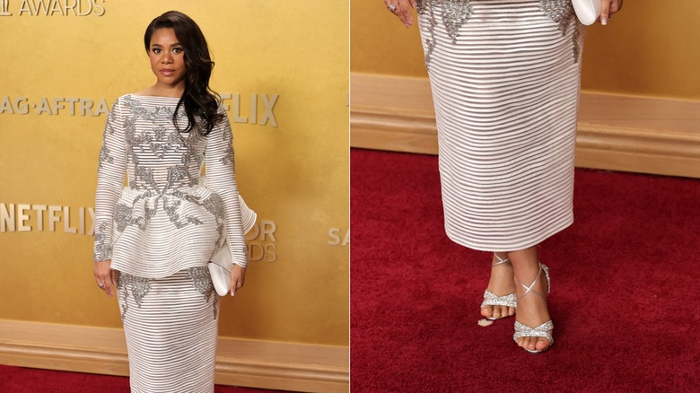 Regina Hall wearing an white striped dress with embellished silver heels