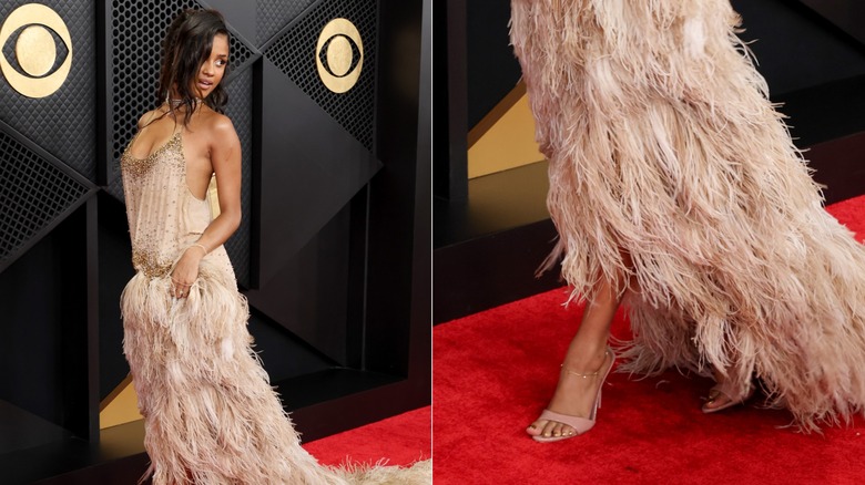 Tyla wearing nude heels with an embellish pink vest with a feather skirt