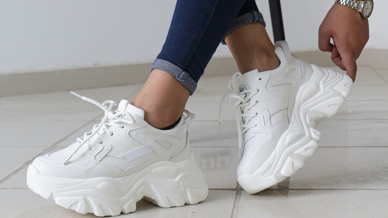 A person wearing chunky sneakers