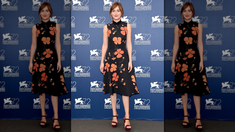 Dakota Johnson in a black dress in Venice in 2015