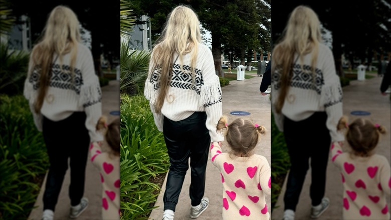 Erika Kirk wearing leather joggers while walking with her daughter at the zoo