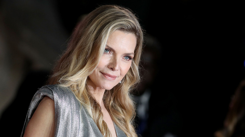 Michelle Pfeiffer on the red carpet in a silver dress