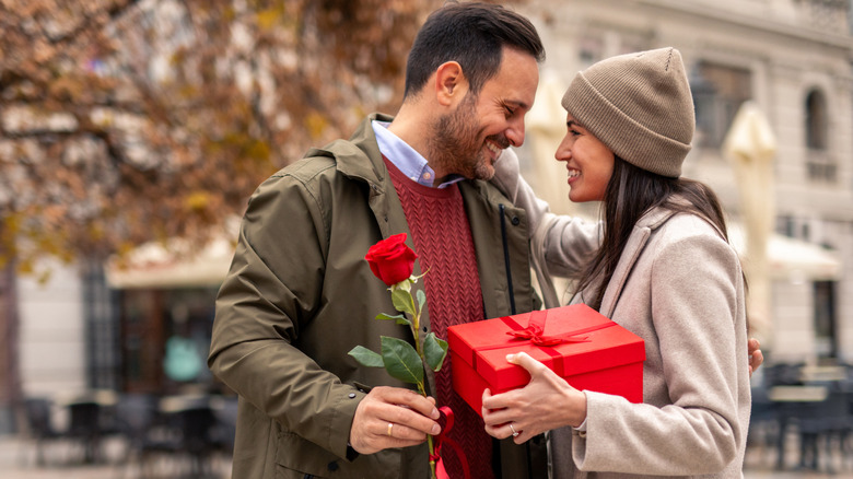 A couple gift-giving on Valentine's Day