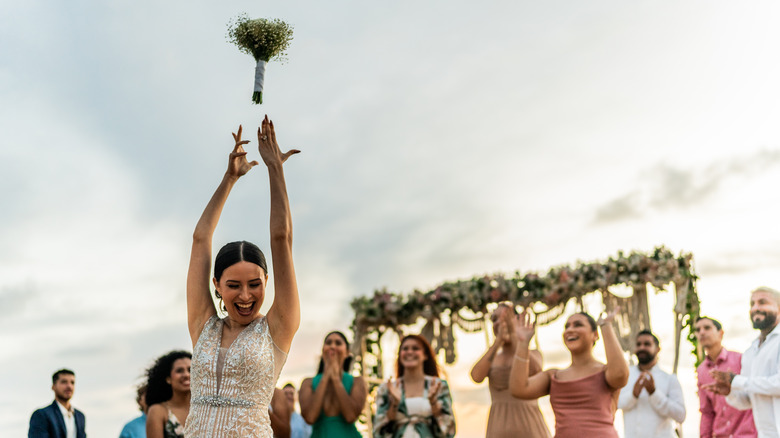 Bride tossing the bouquet