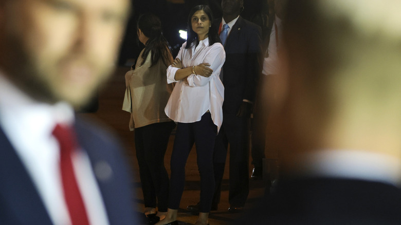 Usha Vance looks on as U.S. Vice President JD Vance speaks to the media before boarding Air Force Two april 2026