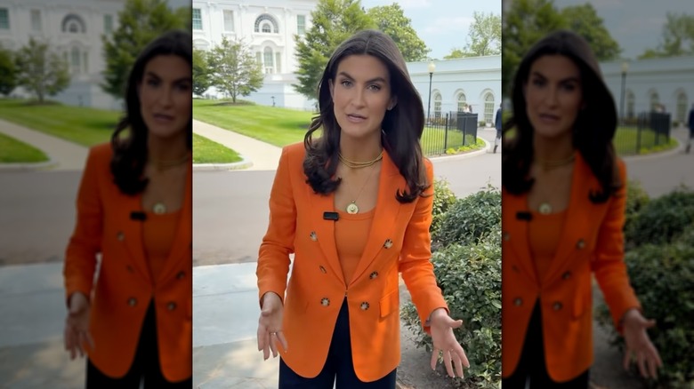 Kaitlan Collins wearing bright orange and standing outside in D.C. in June 2025
