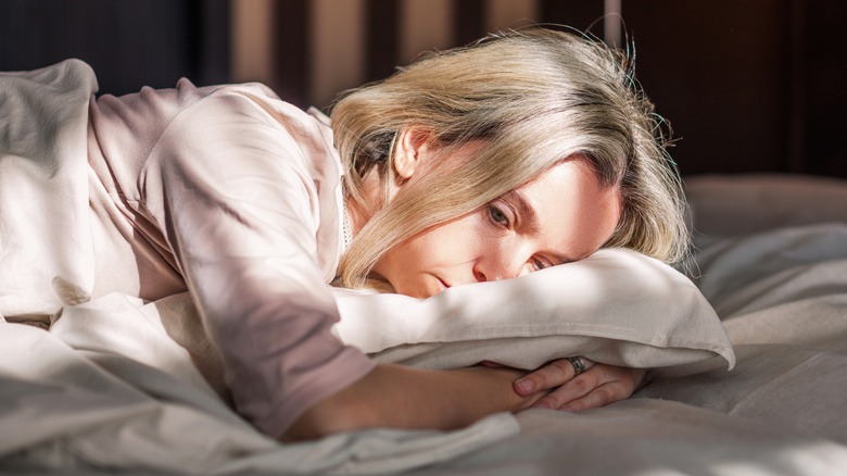 woman thinking in bed 