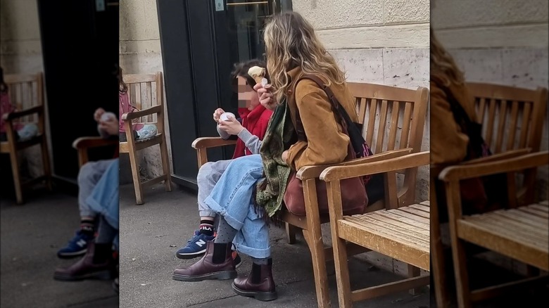 Woman wearing oxblood color boots