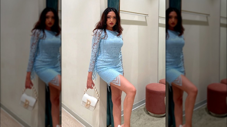 A woman in a pale blue dress 