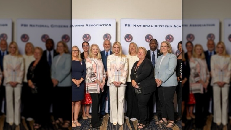 Pam Bondi in a pastel plaid broken suit