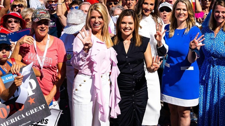 Pam Bondi in a pink, frilly top