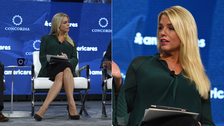 Pam Bondi in green and black on stage with two men