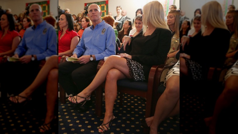 Pam Bondi at an event in a short skirt with her legs crossed