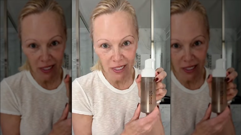 Pamela Anderson on Instagram holding a face wash in her bathroom
