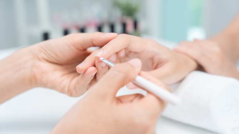 A person getting a manicure